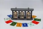 Prayer wheel with Om Mani Padme Hum and Eight Auspicious Symbols on wooden frame