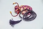 Amethyst Stone Mala – handcrafted 108-bead prayer necklace made from natural amethyst gemstones, known for enhancing calm, clarity, and spiritual awareness. Ideal for meditation, mantra chanting, and chakra healing.