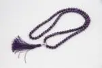 Amethyst Stone Mala – handcrafted 108-bead prayer necklace made from natural amethyst gemstones, known for enhancing calm, clarity, and spiritual awareness. Ideal for meditation, mantra chanting, and chakra healing.
