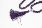 Amethyst Stone Mala – handcrafted 108-bead prayer necklace made from natural amethyst gemstones, known for enhancing calm, clarity, and spiritual awareness. Ideal for meditation, mantra chanting, and chakra healing.