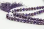 Amethyst Stone Mala – handcrafted 108-bead prayer necklace made from natural amethyst gemstones, known for enhancing calm, clarity, and spiritual awareness. Ideal for meditation, mantra chanting, and chakra healing.