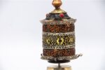 Tibetan mantra prayer wheel with embossed Om Mani Padme Hum