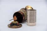 Tibetan mantra prayer wheel with embossed Om Mani Padme Hum