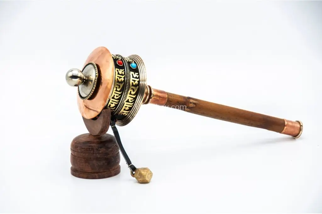 Handheld Dharma prayer wheel engraved with Om Mani Padme Hum