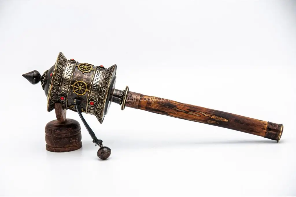 Handheld Tibetan Prayer Wheel with wooden handle and engraved mantra