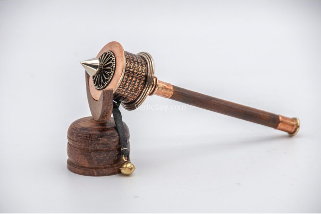 Copper prayer wheel with engraved Om Mani Padme Hum mantra