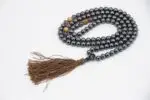 Hematite, Amethyst & Picture Jasper Prayer Beads – handcrafted 108-bead mala combining grounding hematite, calming amethyst, and earthy picture jasper for balance, clarity, and emotional healing. Ideal for meditation and spiritual practice.