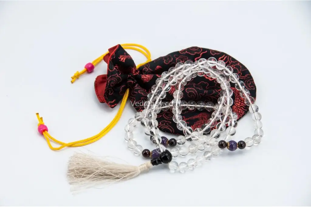 Himalayan Crystal, Garnet & Amethyst Mala – handcrafted 108-bead prayer necklace combining clear Himalayan quartz for purity, garnet for vitality, and amethyst for spiritual insight. Ideal for meditation, chakra alignment, and energy healing.