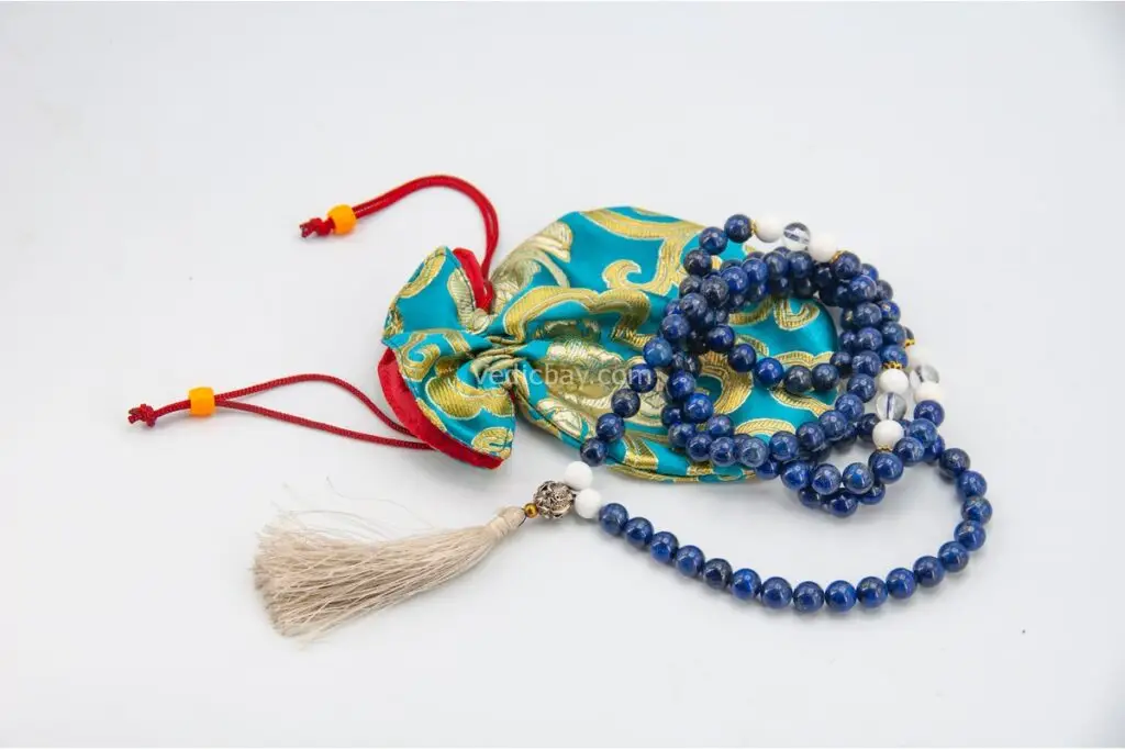 Lapis, Conch Shell & Crystal Mala – handcrafted 108-bead prayer necklace combining lapis lazuli for wisdom, conch shell for purity, and crystal quartz for clarity and spiritual energy. Ideal for meditation, mantra chanting, and chakra alignment.