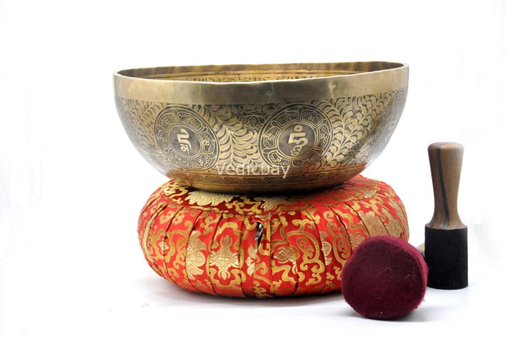 Large handmade singing bowl with Buddha engraving, Tibetan mantras, and mandala base
