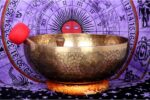 Extra large handmade singing bowl featuring Buddha Foot in center, mantra etching, and Eight Auspicious Symbols