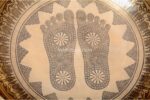 Extra large handmade singing bowl featuring Buddha Foot in center, mantra etching, and Eight Auspicious Symbols