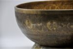 Large handmade singing bowl with Yin Yang Tree of Life design, mantra etching, and chakra healing use