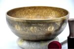 Large handmade singing bowl with Yin Yang Tree of Life design, mantra etching, and chakra healing use