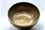 Large handmade singing bowl with Yin Yang Tree of Life design, mantra etching, and chakra healing use