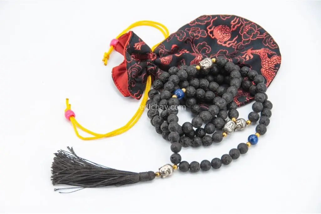 Lava Stone Mala with Buddha Head – handcrafted 108-bead prayer necklace made from natural lava stones with a Buddha head bead centerpiece, symbolizing grounding, strength, and spiritual awareness. Ideal for meditation and daily mindfulness.