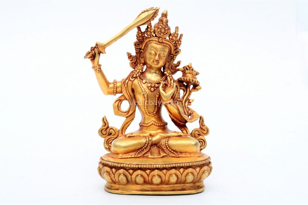 Handcrafted Manjushree Statue wielding a flaming sword and holding a scripture – made from brass with intricate carvings, symbolizing wisdom, knowledge, and enlightenment.