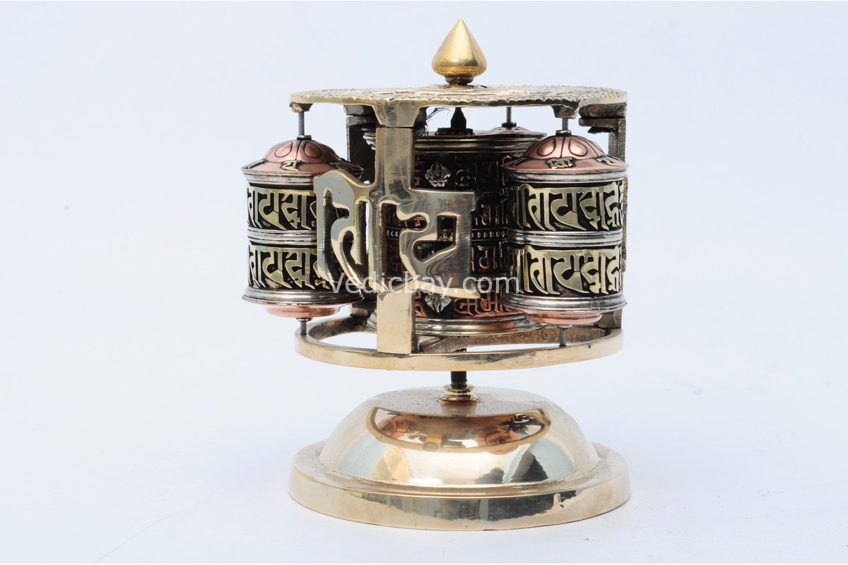 Tibetan Dharma Wheel featuring 4 copper prayer wheels with internal scrolls and embossed auspicious symbols. Handmade in Nepal.