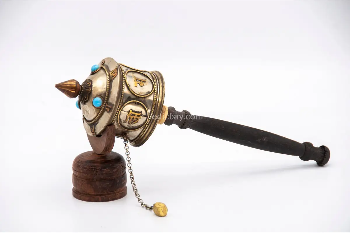 Close-up of Om Mani Padme Hum engraved copper wheel