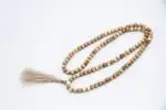 Old Conch Shell Mala – handcrafted 108-bead prayer necklace made from aged conch shells, symbolizing sacred sound, purity, and spiritual transformation. Ideal for mantra chanting, deep meditation, and traditional rituals.