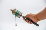 Handcrafted Tibetan Dharma wheel with colorful stones from Nepal