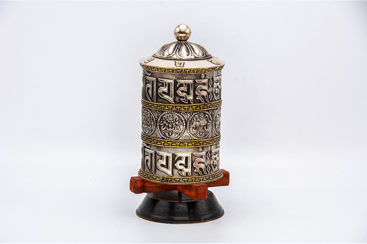White metal prayer wheel with embossed eight auspicious symbols from Nepal