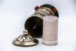 White metal prayer wheel with embossed eight auspicious symbols from Nepal