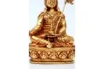 Handcrafted Padmasambhava (Guru Rinpoche) Statue seated in royal posture – made from brass with intricate detailing, holding vajra and skull cup, symbolizing spiritual power and transformation.