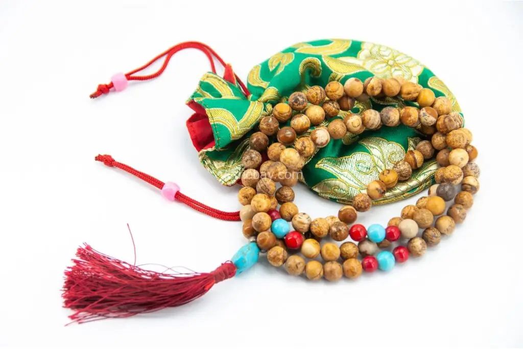 Picture Jasper, Coral & Turquoise Mala – handcrafted 108-bead prayer necklace combining grounding picture jasper, energizing coral, and protective turquoise for balance, vitality, and spiritual harmony. Ideal for meditation and healing rituals.