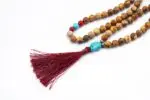 Picture Jasper, Coral & Turquoise Mala – handcrafted 108-bead prayer necklace combining grounding picture jasper, energizing coral, and protective turquoise for balance, vitality, and spiritual harmony. Ideal for meditation and healing rituals.