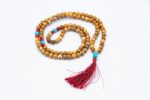 Picture Jasper, Coral & Turquoise Mala – handcrafted 108-bead prayer necklace combining grounding picture jasper, energizing coral, and protective turquoise for balance, vitality, and spiritual harmony. Ideal for meditation and healing rituals.
