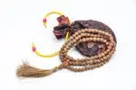 Raktu Seed Mala – handcrafted 108-bead prayer necklace made from natural raktu seeds, symbolizing protection, grounding, and spiritual focus. Ideal for meditation, mantra chanting, and daily spiritual practice