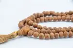 Raktu Seed Mala – handcrafted 108-bead prayer necklace made from natural raktu seeds, symbolizing protection, grounding, and spiritual focus. Ideal for meditation, mantra chanting, and daily spiritual practice