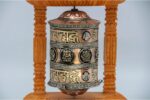 “8-inch wall hanging Tibetan prayer wheel with wooden frame and Austamangal symbol, handmade in Nepal”