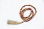 Sandalwood Mala – handcrafted 108-bead prayer necklace made from fragrant natural sandalwood, known for promoting calm, devotion, and inner peace. Ideal for meditation, prayer, and spiritual focus.