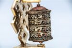 5 inch tabletop Tibetan prayer wheel with 4-line mantra and brass base handmade in Nepal