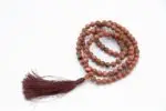 Sunstone Mala – handcrafted 108-bead prayer necklace made from natural sunstone, symbolizing joy, vitality, and personal power. Ideal for meditation, mantra chanting, and energy boosting practices.