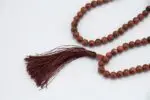 Sunstone Mala – handcrafted 108-bead prayer necklace made from natural sunstone, symbolizing joy, vitality, and personal power. Ideal for meditation, mantra chanting, and energy boosting practices.