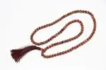 Sunstone Mala – handcrafted 108-bead prayer necklace made from natural sunstone, symbolizing joy, vitality, and personal power. Ideal for meditation, mantra chanting, and energy boosting practices.