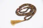 Discover our carefully handcrafted mala collection, featuring 108-bead necklaces made from natural gemstones, sacred wood, and ethically sourced bone. Traditionally used for mantra chanting, meditation, and spiritual focus, malas are powerful tools to support mindfulness and inner balance. Each piece is designed to enhance energy alignment, promote calm, and deepen your personal practice. Whether you're drawn to the healing properties of stones or the symbolic meaning of each material, our malas offer both spiritual significance and timeless beauty. Ideal for meditation, yoga, prayer, or as meaningful gifts.
