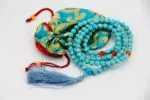 Turquoise Stone Mala – handcrafted 108-bead prayer necklace made from natural turquoise gemstones, symbolizing protection, healing, and spiritual balance. Ideal for meditation, mantra chanting, and energy alignment.