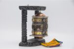 Wall hanging Tibetan prayer wheel with Austamangal and carved wooden base