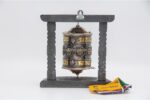 Wall hanging Tibetan prayer wheel with Austamangal and carved wooden base