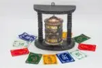 Wall hanging Tibetan prayer wheel with Austamangal and carved wooden base