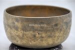 Collected antique Thadobati singing bowl showing natural patina, aged marks, and authentic surface texture