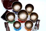 7 Chakra Tibetan Mantra Etched Singing Bowl Set of 7 with mallets, cushions, carry box, and bracelet – handmade in Nepal