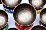 7 Chakra Tibetan Mantra Etched Singing Bowl Set of 7 with mallets, cushions, carry box, and bracelet – handmade in Nepal
