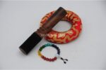 7 inch handmade Jhumka singing bowl crafted in Nepal with 7 chakra stone bracelet, mallet, and cushion