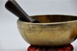 7 inch handmade Tibetan Lingam singing bowl with dim finish – rare Himalayan bowl with central lingam, includes mallet and cushion