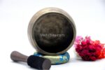 Collected antique Mani singing bowl showing natural patina, aged surface marks, and authentic texture